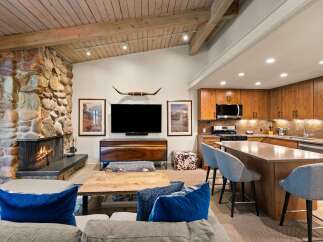 Experience rustic charm and modern convenience in this open-concept living space.