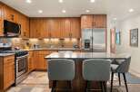 Experience culinary excellence in this beautifully appointed kitchen, featuring custom wood cabinetry and sleek, modern countertops.
