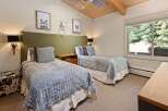 This charming bedroom features two comfortable twin beds, perfect for accommodating guests or family.
