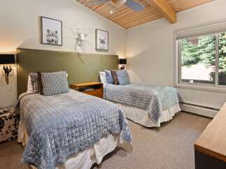 This charming bedroom features two comfortable twin beds, perfect for accommodating guests or family.