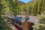 Experience mountain living at its finest with this charming property nestled amongst lush trees and rolling hills.