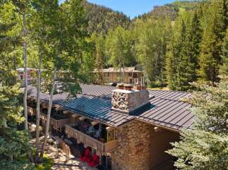 Experience mountain living at its finest with this charming property nestled amongst lush trees and rolling hills.