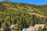 Experience luxury mountain living with this stunning property offering breathtaking views of the ski slopes and surrounding evergreen forests.