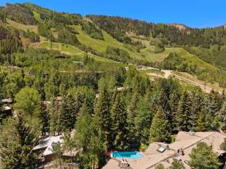 Experience luxury mountain living with this stunning property offering breathtaking views of the ski slopes and surrounding evergreen forests.