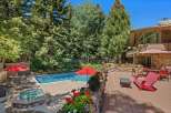 Escape to this stunning mountain retreat featuring a sparkling swimming pool and a relaxing hot tub, perfect for unwinding after a day of adventure.