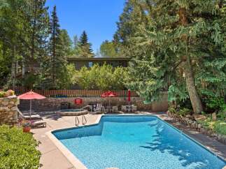 Enjoy a refreshing dip in this stunning outdoor pool, perfect for sunny days.