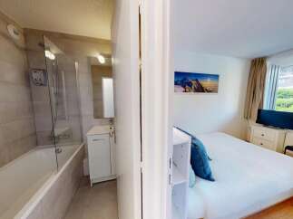 Discover this charming property featuring a well-appointed bathroom with a bathtub and shower, perfect for relaxation.