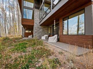Experience modern mountain living in this stunning architectural home, nestled amongst a serene aspen grove.