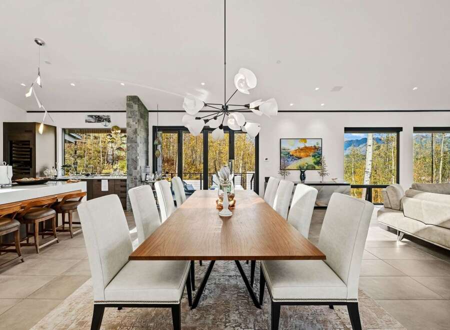 Experience luxurious open-concept living in this stunning dining and kitchen area, perfect for entertaining.