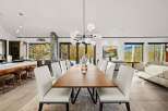 Experience luxurious open-concept living in this stunning dining and kitchen area, perfect for entertaining.