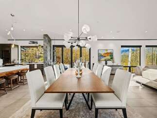 Experience luxurious open-concept living in this stunning dining and kitchen area, perfect for entertaining.
