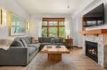 Experience ultimate comfort in this spacious living room, featuring a large sectional sofa perfect for gatherings.