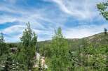 Nestled amidst lush greenery and rolling hills, this property offers a serene mountain escape.