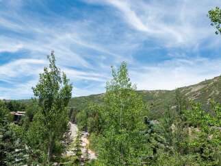 Nestled amidst lush greenery and rolling hills, this property offers a serene mountain escape.