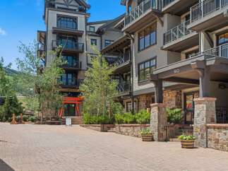 Experience luxury mountain living in this stunning property featuring modern architecture and exquisite stone accents.