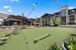 Experience outdoor living at its finest in this vibrant community space, featuring a lush green lawn perfect for recreation and relaxation.