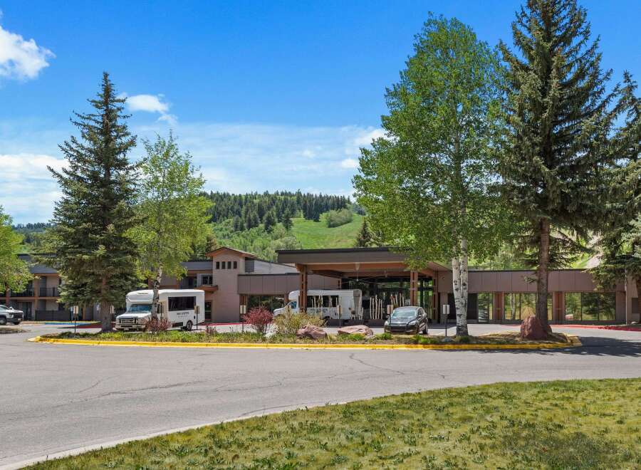 Discover this inviting hotel nestled amidst lush greenery and rolling hills, offering a serene mountain getaway.