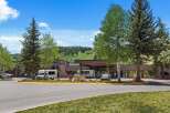 Discover this inviting hotel nestled amidst lush greenery and rolling hills, offering a serene mountain getaway.