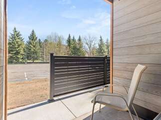 Enjoy the fresh mountain air from this private patio, perfect for morning coffee or evening relaxation.