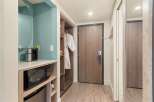 This hotel room offers convenient amenities, including a microwave, coffee maker, and a mini-fridge, perfect for a comfortable stay.