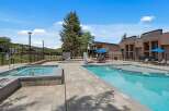 Experience luxury outdoor living with this stunning pool and spa area, perfect for relaxation and entertainment.