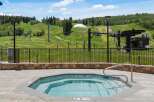 Enjoy a relaxing soak in this octagonal hot tub, complete with a stainless steel handrail for easy access.
