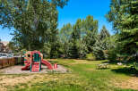 Enjoy outdoor fun in this property's dedicated playground area, complete with a colorful slide and climbing structure.