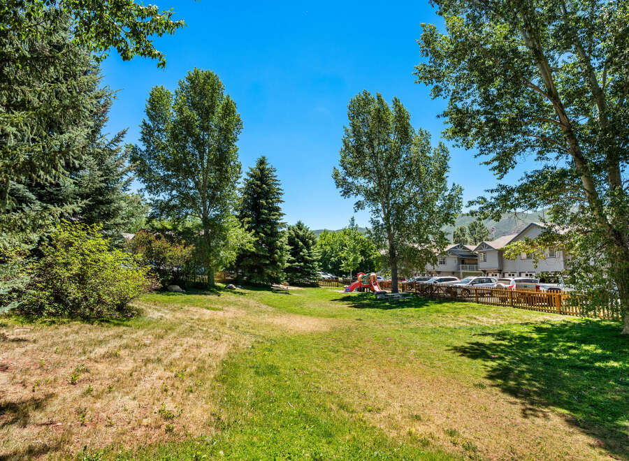 Enjoy outdoor living in this spacious backyard, perfect for recreation and relaxation.