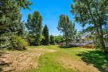 Enjoy outdoor living in this spacious backyard, perfect for recreation and relaxation.