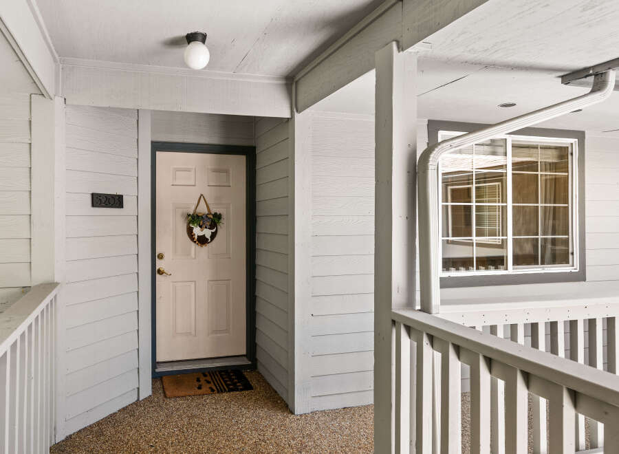 Welcome to this charming property featuring a welcoming entryway with a decorative door and a convenient doormat.