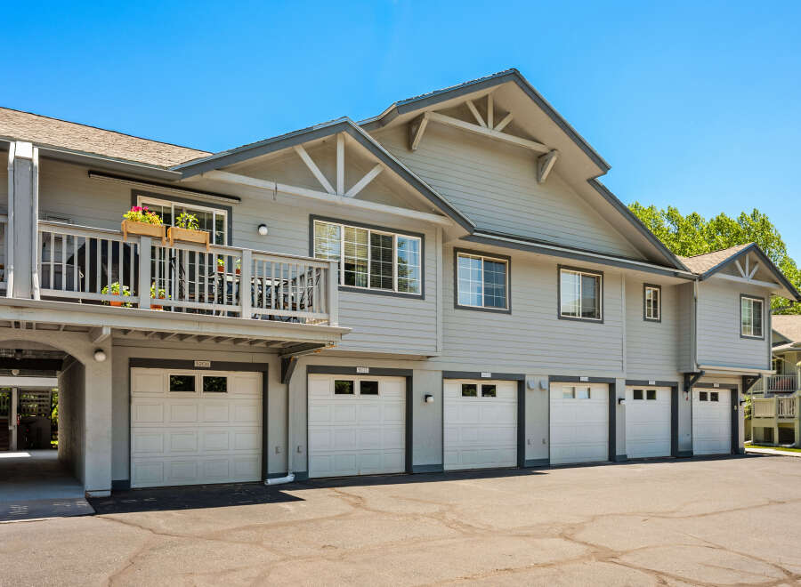 Discover comfortable living in this charming townhouse complex featuring multiple garages and private balconies.