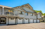 Discover comfortable living in this charming townhouse complex featuring multiple garages and private balconies.