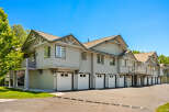 Discover modern living in this beautifully maintained townhome complex, featuring attached garages for convenient parking and storage.