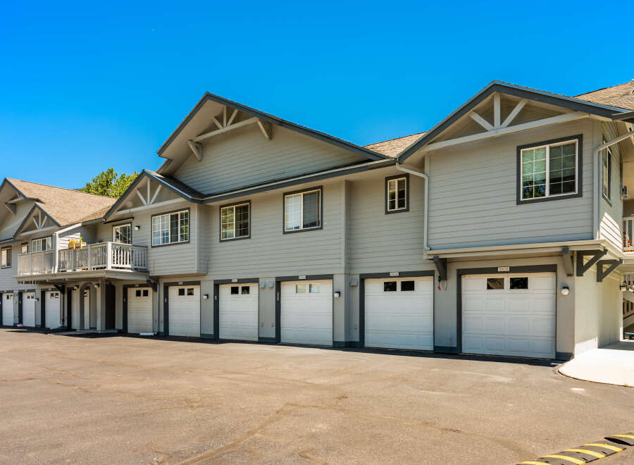 Discover comfortable living in this townhome complex featuring multiple garages and private balconies.