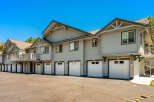 Discover comfortable living in this townhome complex featuring multiple garages and private balconies.