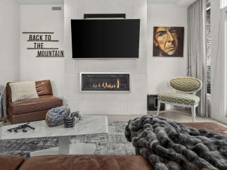 Experience modern living with this stunning living room featuring a sleek gas fireplace as the centerpiece, perfect for cozy evenings.