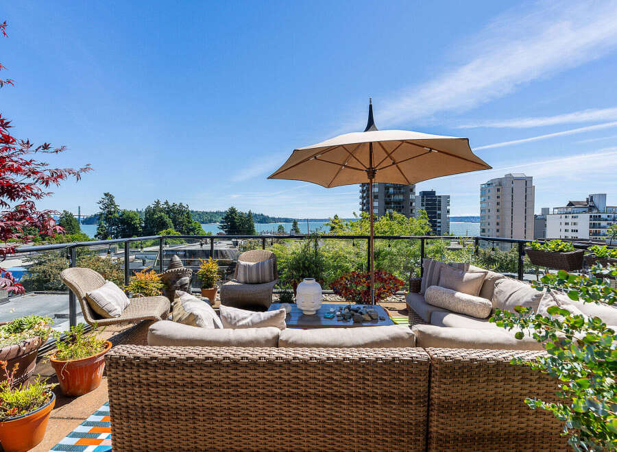Enjoy breathtaking water and city views from this expansive rooftop patio, perfect for entertaining or relaxing.