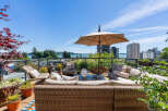 Enjoy breathtaking water and city views from this expansive rooftop patio, perfect for entertaining or relaxing.
