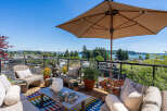Enjoy breathtaking panoramic views from this stunning rooftop patio, perfect for entertaining or relaxing.