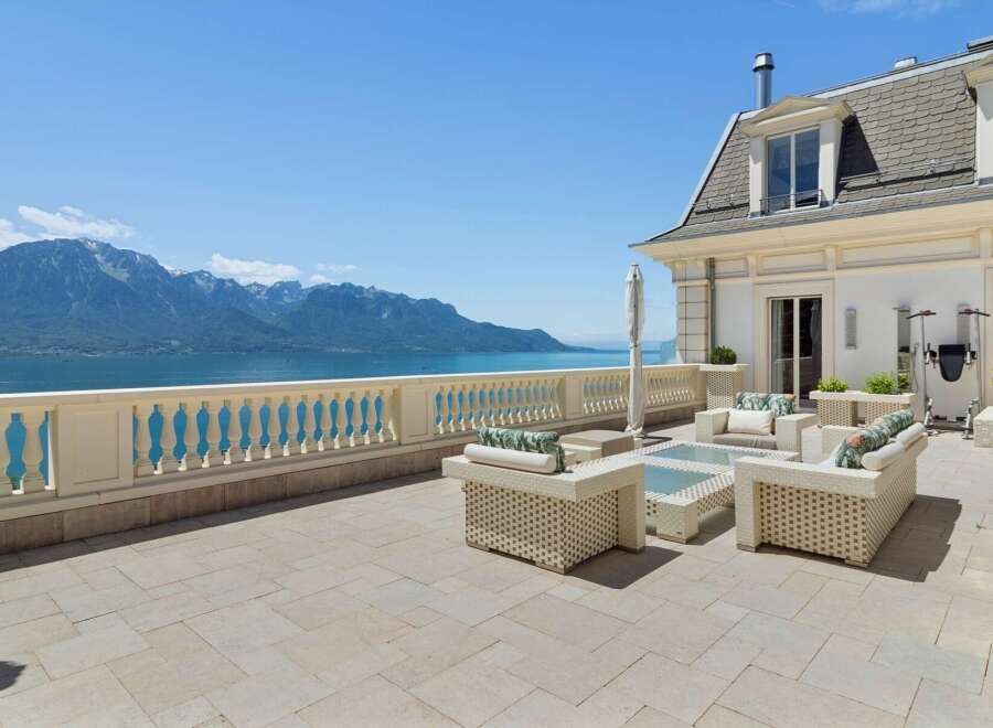 Experience breathtaking panoramic views of the lake and mountains from this expansive terrace.