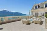 Experience breathtaking panoramic views of the lake and mountains from this expansive terrace.