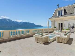 Experience breathtaking panoramic views of the lake and mountains from this expansive terrace.
