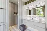 Experience luxury in this modern bathroom featuring exquisite marble finishes throughout.