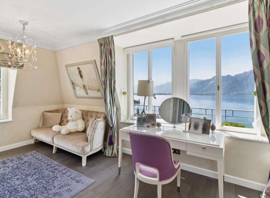 Experience breathtaking lake and mountain views from this elegant room, perfect for relaxation and rejuvenation.