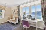 Experience breathtaking lake and mountain views from this elegant room, perfect for relaxation and rejuvenation.