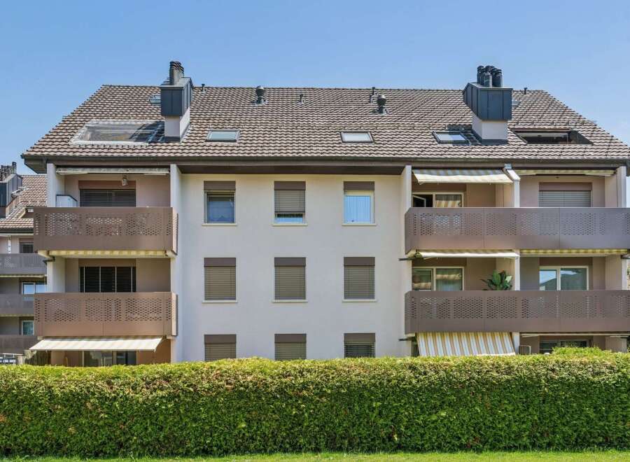 Discover modern living in this apartment building featuring spacious balconies with attractive metal railings, perfect for enjoying outdoor space.