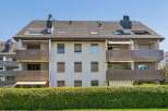 Discover modern living in this apartment building featuring spacious balconies with attractive metal railings, perfect for enjoying outdoor space.