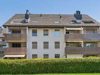 Discover modern living in this apartment building featuring spacious balconies with attractive metal railings, perfect for enjoying outdoor space.