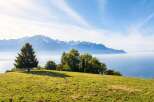 Experience breathtaking panoramic views from this stunning property, offering a serene escape with majestic mountains and a tranquil lake as your backdrop.