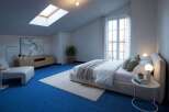 Experience modern comfort in this attic bedroom, featuring a spacious king-sized bed with plush linens and a cozy throw.